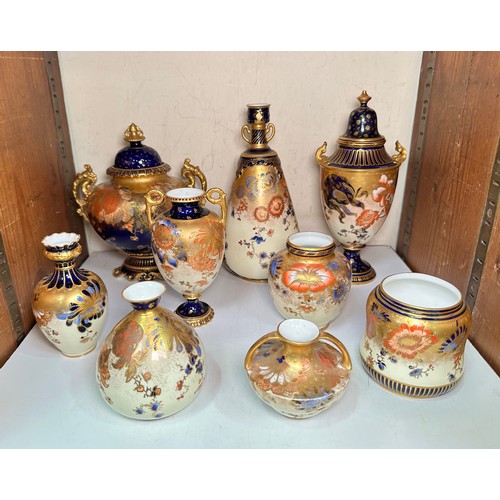 55 - A collection of nine late 19th Century and early 20th Century Royal Crown Derby vases, decorated in ... 