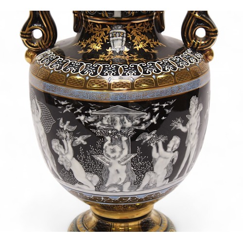 88 - A 20th century twin handled vase and cover, in the Minton pâte-sur-pâte style, decorated with cherub... 