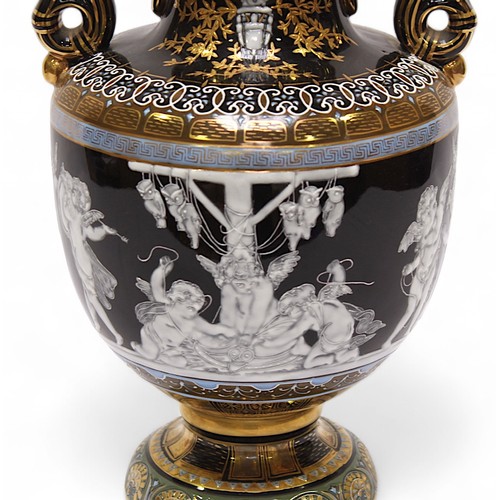 88 - A 20th century twin handled vase and cover, in the Minton pâte-sur-pâte style, decorated with cherub... 