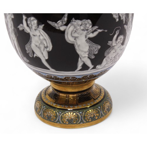 88 - A 20th century twin handled vase and cover, in the Minton pâte-sur-pâte style, decorated with cherub... 