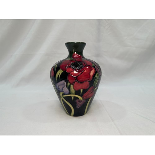 99 - A Moorcroft pottery vase of tapering cylindrical form with flared rim, in the ‘Anemone Tribute’ patt... 