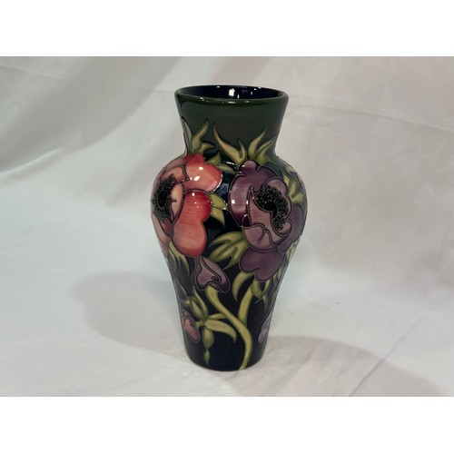 105 - A Moorcroft pottery vase of inverted baluster form with flared rim, in the ‘Anemone Tribute’ pattern... 