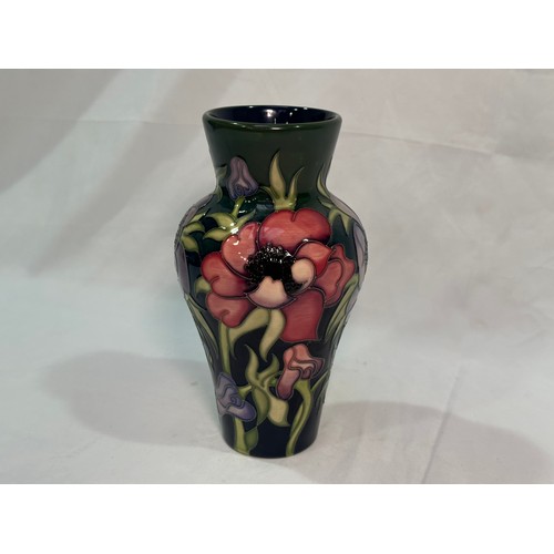 105 - A Moorcroft pottery vase of inverted baluster form with flared rim, in the ‘Anemone Tribute’ pattern... 