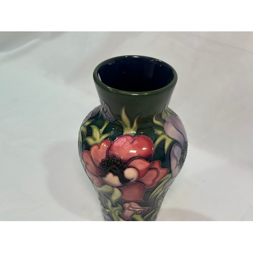 105 - A Moorcroft pottery vase of inverted baluster form with flared rim, in the ‘Anemone Tribute’ pattern... 