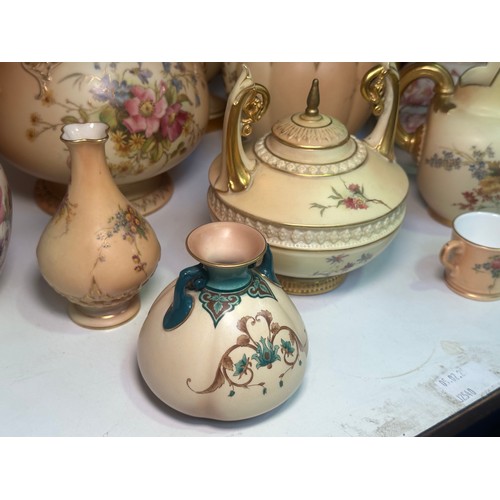 38 - A collection of assorted Royal Worcester blush ivory porcelain vases and jugs, all decorated with ha... 