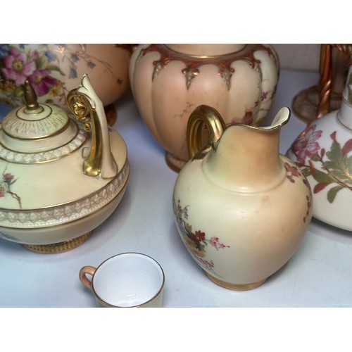 38 - A collection of assorted Royal Worcester blush ivory porcelain vases and jugs, all decorated with ha... 