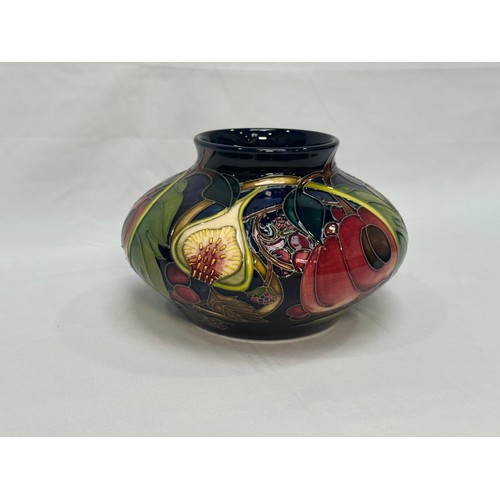 107 - A Moorcroft pottery vase of compressed globular form, in the ‘Queens Choice’ pattern, designed by Em... 