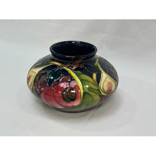 107 - A Moorcroft pottery vase of compressed globular form, in the ‘Queens Choice’ pattern, designed by Em... 