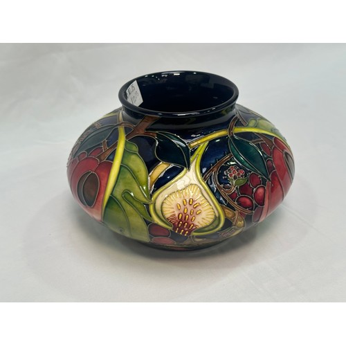 107 - A Moorcroft pottery vase of compressed globular form, in the ‘Queens Choice’ pattern, designed by Em... 