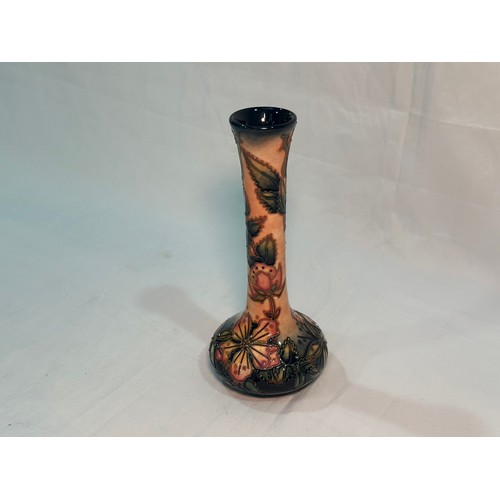 115 - A Moorcroft pottery vase of shaft and globe form, in the ‘Sweet Briar’ pattern designed by Rachel Bi... 