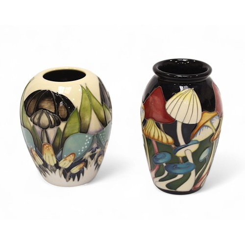 126 - Two small Moorcroft pottery vases of ovoid form, one in the ‘Indigo Lace’ pattern, and another with ... 