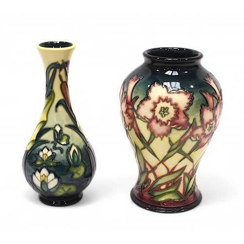 128 - A Moorcroft pottery vase, of bottle form, in the 'Lamia' pattern designed by Rachel Bishop, together... 