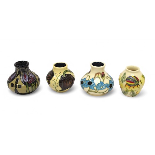 129 - A collection of six Moorcroft pottery items including a small compressed globular vase in the ‘The H... 