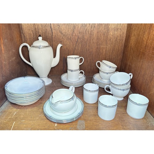 131 - A Wedgwood ‘Amherst’ pattern part tea and coffee service, comprising a coffee pot, coffee cans, tea ... 