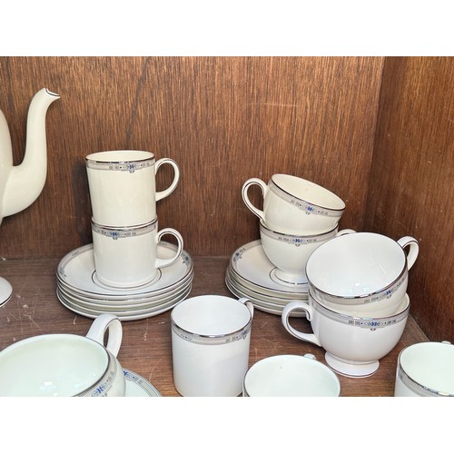 131 - A Wedgwood ‘Amherst’ pattern part tea and coffee service, comprising a coffee pot, coffee cans, tea ... 