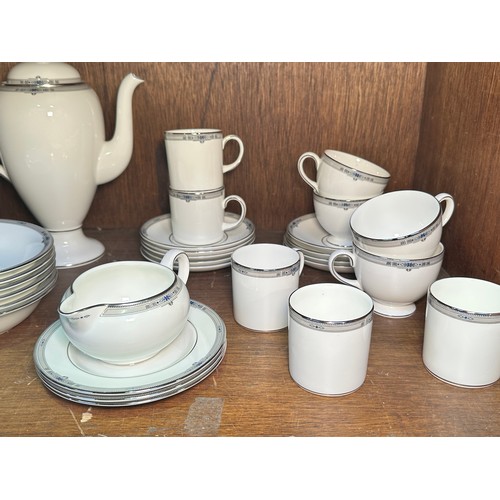 131 - A Wedgwood ‘Amherst’ pattern part tea and coffee service, comprising a coffee pot, coffee cans, tea ... 