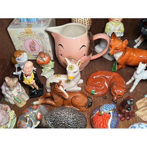 134 - A collection of various ceramic figures, mostly modelled as animals, to include Royal Crown Derby po... 