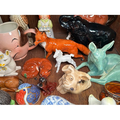 134 - A collection of various ceramic figures, mostly modelled as animals, to include Royal Crown Derby po... 