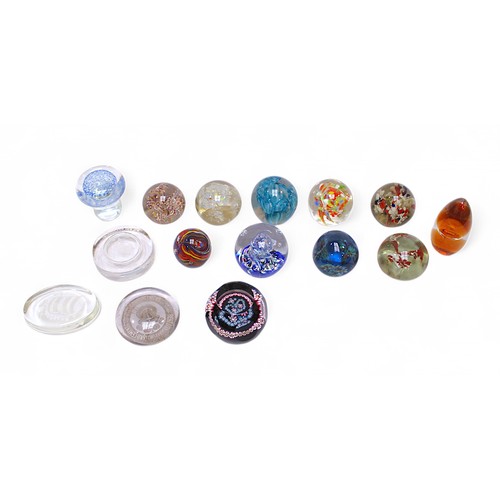 135 - A collection of 15 assorted glass paperweights, including some Caithness examples, one in original f... 