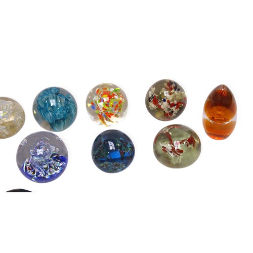 135 - A collection of 15 assorted glass paperweights, including some Caithness examples, one in original f... 