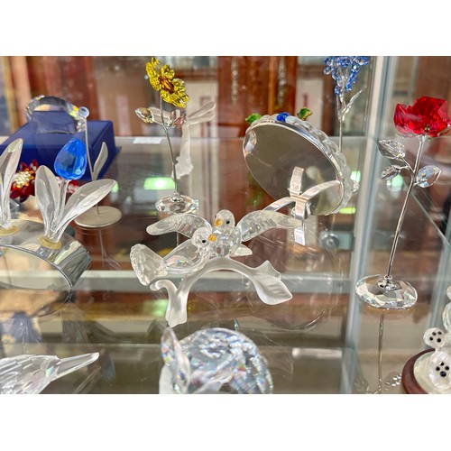 144 - A collection of Swarovski Crystal figures, including Heron, Cheetah, Owl and Elephant, all boxed, Bl... 