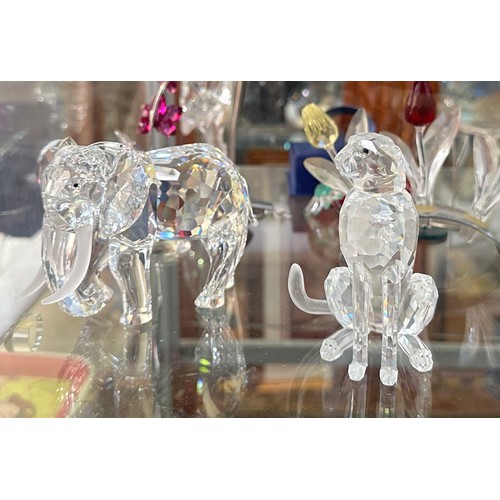 144 - A collection of Swarovski Crystal figures, including Heron, Cheetah, Owl and Elephant, all boxed, Bl... 