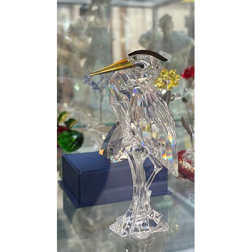 144 - A collection of Swarovski Crystal figures, including Heron, Cheetah, Owl and Elephant, all boxed, Bl... 