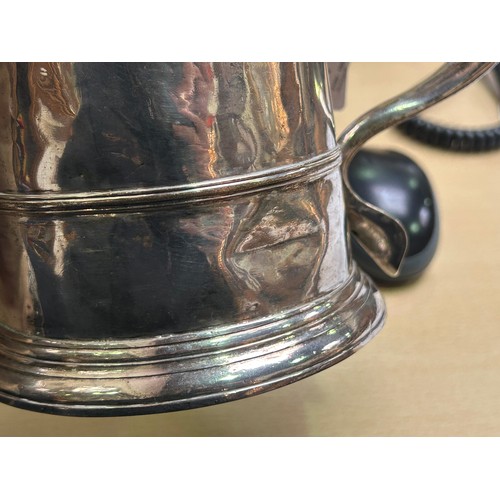 171 - A George I lidded silver tankard by Humphrey Payne, of plain design and with scrolled thumb-piece, r... 