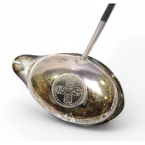 155 - A George III silver toddy ladle by John Merry, the bowl with shaped spout and set with George II sil... 