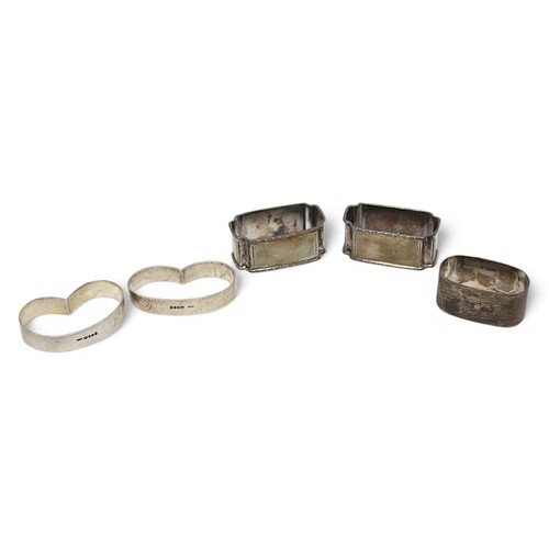 162 - Five various 20th Century silver napkin rings, including a George V pair inscribed ‘J’ and ‘B’, gros... 