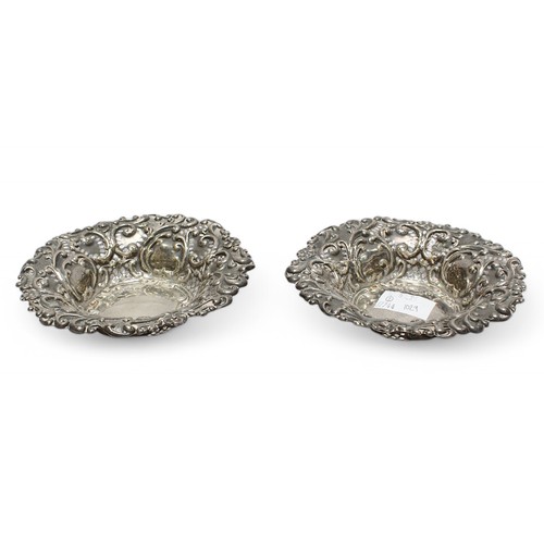 159 - A pair of early Edwardian pierced silver Bon-Bon dishes decorated in the rococo revival style with s... 