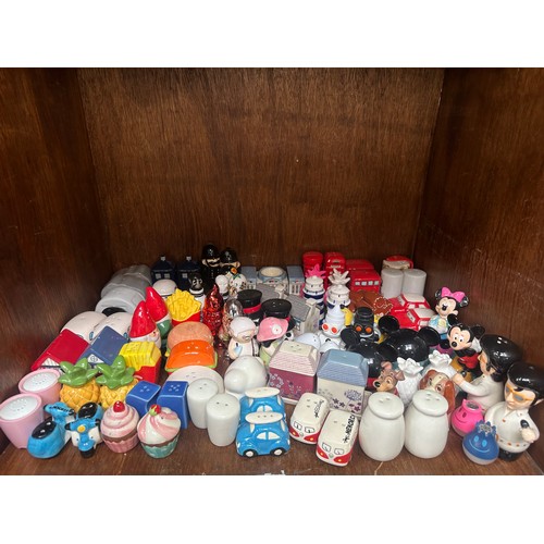 76 - An extensive collection of salt and pepper shakers including various animals, Disney characters and ... 