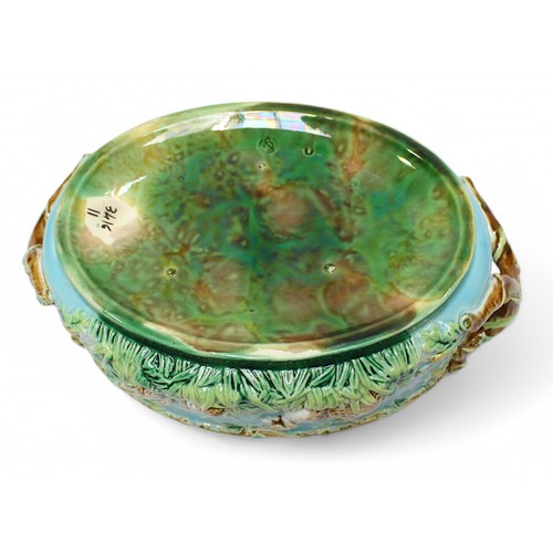 69 - A 19th century George Jones Majolica game pie dish and cover, of oval form, the body moulded with a ... 