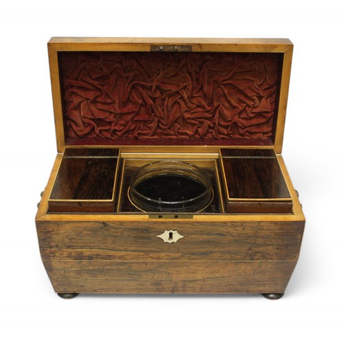 383 - A Victorian rosewood tea caddy, of sarcophagus form, the cover enclosing a fitted and lined interior... 