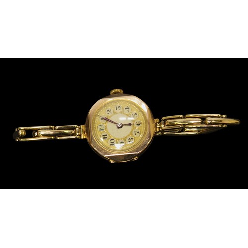 196 - A 9ct gold cased ladies wristwatch, the gilt dial with Arabic numerals denoting hours, on later gold... 