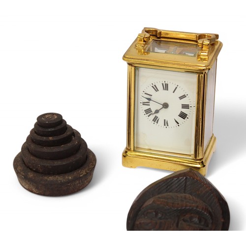 384 - A mixed lot, comprising a 19th Century French brass cased carriage clock, the white enamel dial with... 