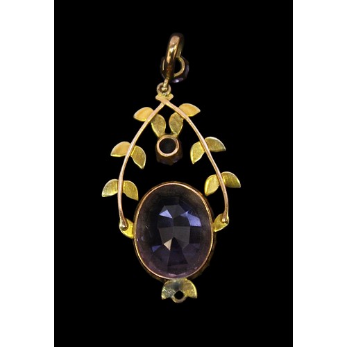 225 - An antique yellow metal, tests as 9ct gold or above, pendant, set with a large oval faceted amethyst... 