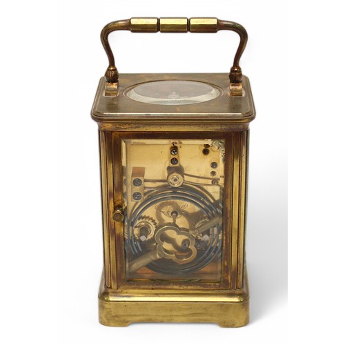 461 - A large brass cased carriage clock, the white enamel dial with Roman numerals denoting hours, expose... 