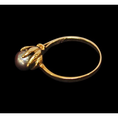 232 - A gold-plated three-piece ring and earring suite, set with black simulated pearls, together with a g... 