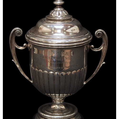 179 - A George V silver twin-handled trophy and cover by William Neale & Son Ltd, Birmingham, 1922, with s... 