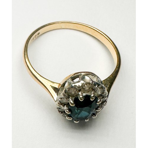 234 - An 18ct yellow gold and platinum dress ring, claw set to the centre with an oval faceted sapphire, m... 