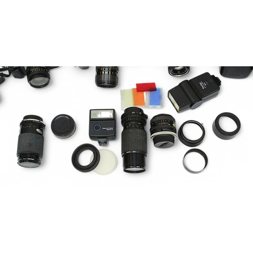 456 - A collection of assorted camera equipment, comprising Canon AE-1 Program 35mm SLR with Canon 50mm f1... 