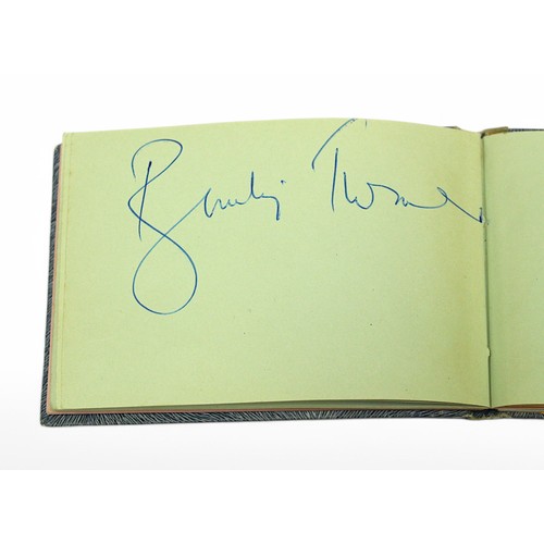 400 - An autograph book containing the signatures of Diana Dors, Bruce Forsyth, Bobby Vee, Tony Orlando, R... 