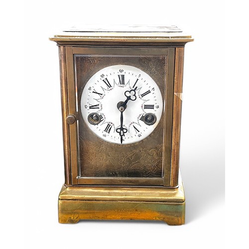 467 - A White Onyx mantel clock with eight-day movement striking a bell, surmounted by a classical dressed... 