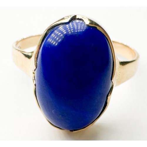 272 - An 18ct gold dress ring, bezel set with an oval-shaped blue cabochon-cut stone, measuring approximat... 