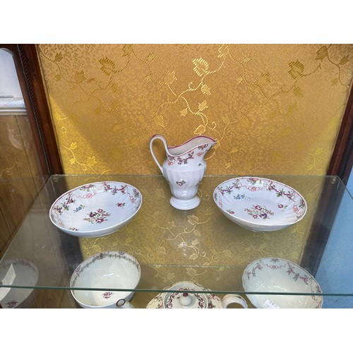 115 - A quantity of New Hall porcelain tea wares, comprising mostly spiral fluted wares and pink ribbon pa... 