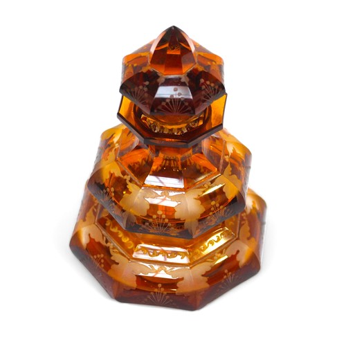 120 - A Bohemian amber glass perfume bottle, two-tier stepped octagonal form, with etched foliate decorati... 