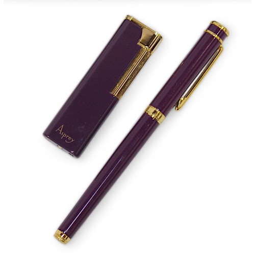 404 - A collection of assorted vintage Asprey collectables, comprising a boxed fountain pen and boxed ligh... 