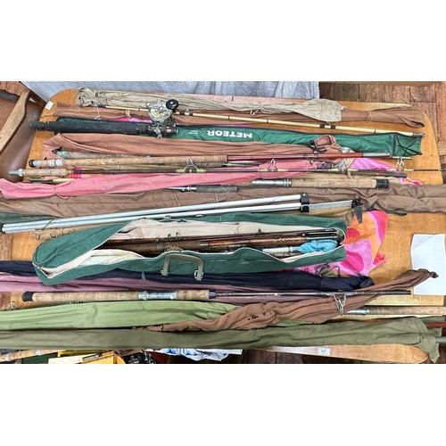 430 - A collection of various fishing rods with cases, longest measures 184cm.