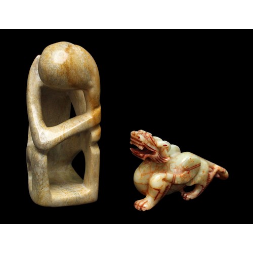 415 - A carved jade-coloured soapstone figure of a dragon, 9x14cm, together with Henry Moore 'style' soaps... 